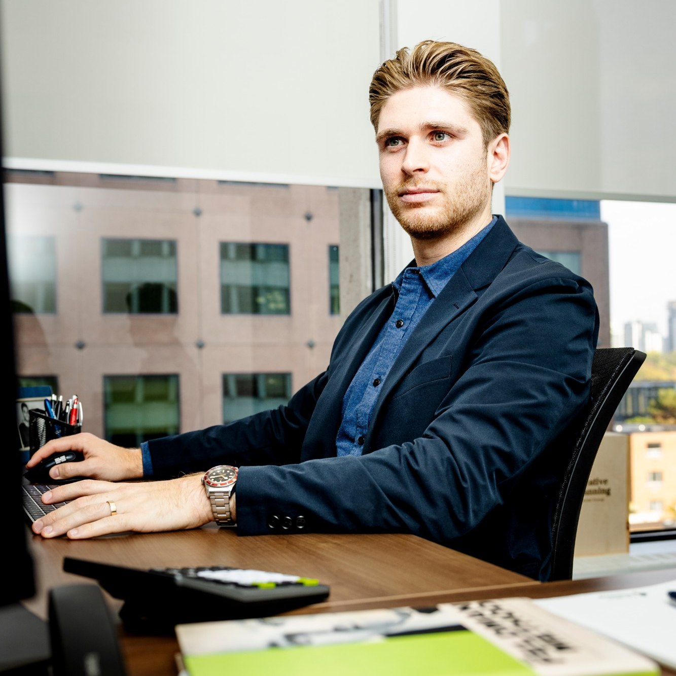 Chase Kalish working at his desk